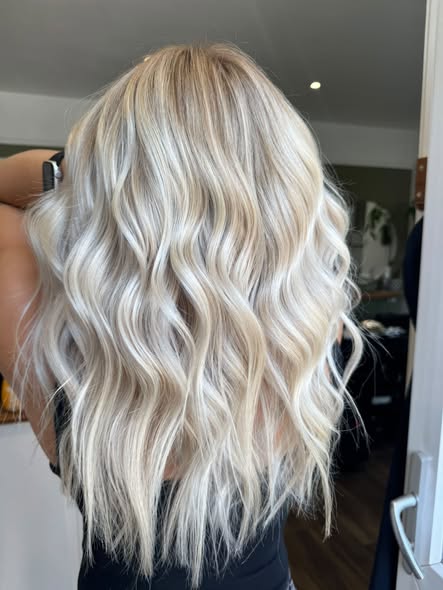 Bright blonde waves created at Eden and Wilde